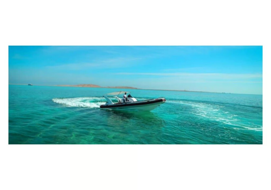 Speedboat turning on turquoise water
